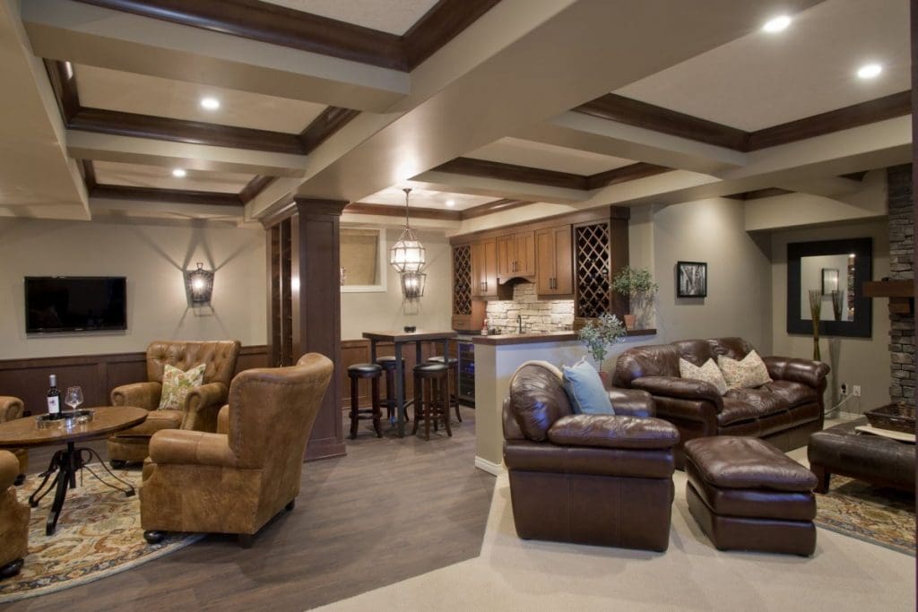 Renova homes and renovations basement renovation with red oak accents and dark leather furniture