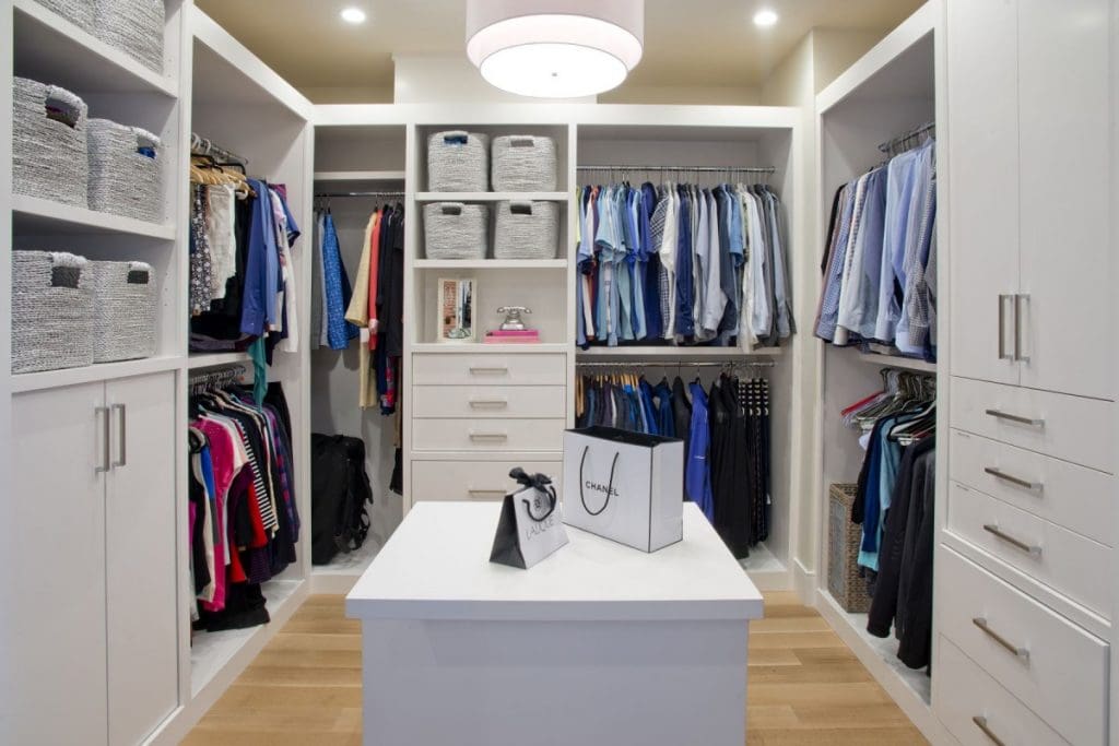 Renova Homes and Renovations, Custom closet with white shelves and island for getting ready