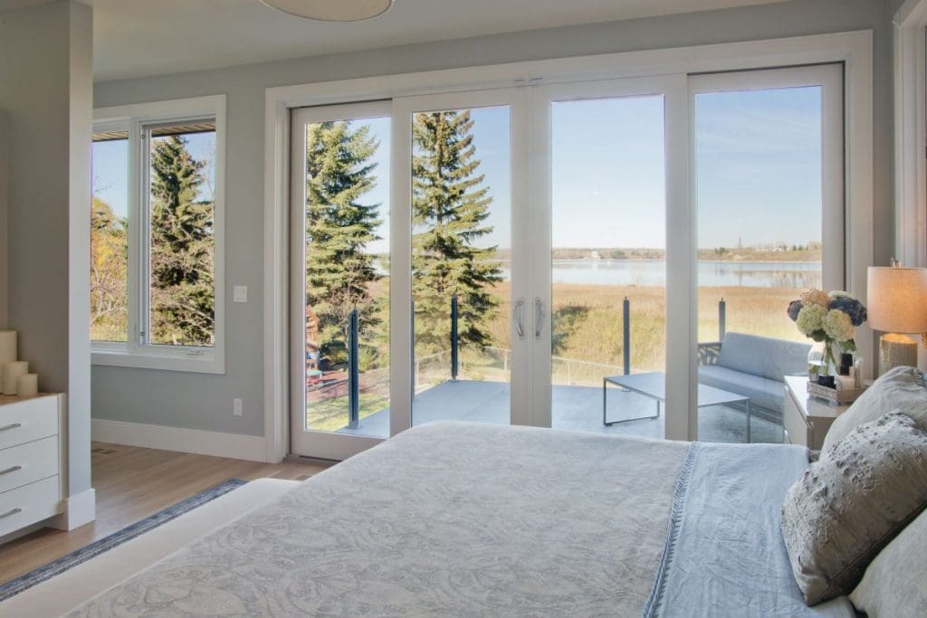 Bayview Custom home, master bedroom overlooking wetland with spacious patio deck off the bedroom