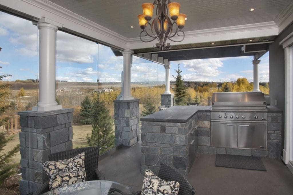 Bearspaw exterior with glass walls and outdoor barbequing station