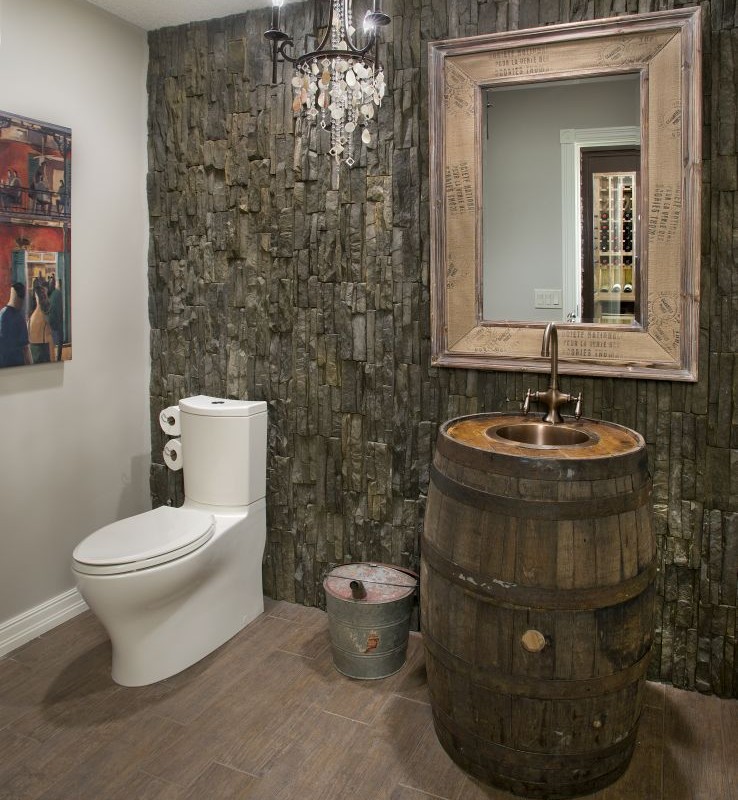 Bearspaw Project By Renova Homes & Renovations Calgary, Alberta custom bathroom with stone wall, and whiskey barrel sink vanity