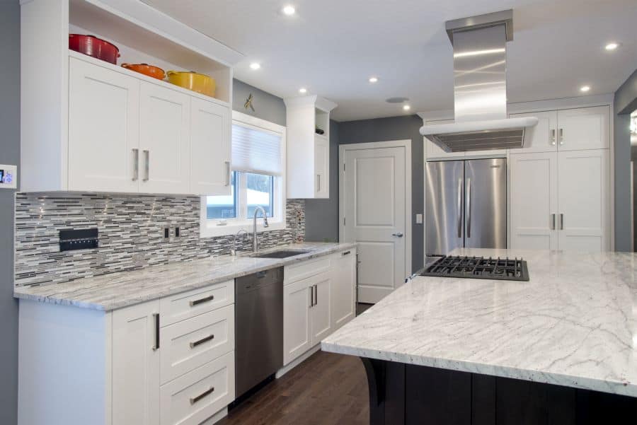 Brentwood Project By Renova Homes & Renovations In Calgary, Alberta kitchen renovation with large island and hoodvent