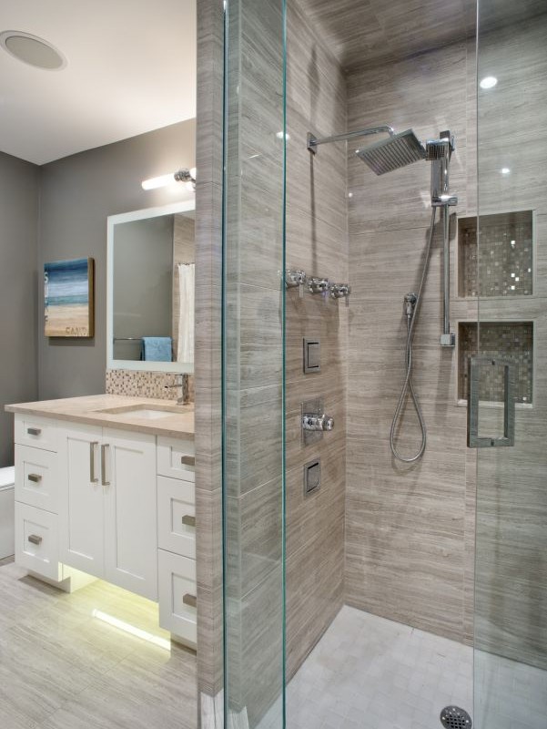 Brentwood Project By Renova Homes & Renovations In Calgary, Alberta Bathroom with stone shower and waterfall shower heads