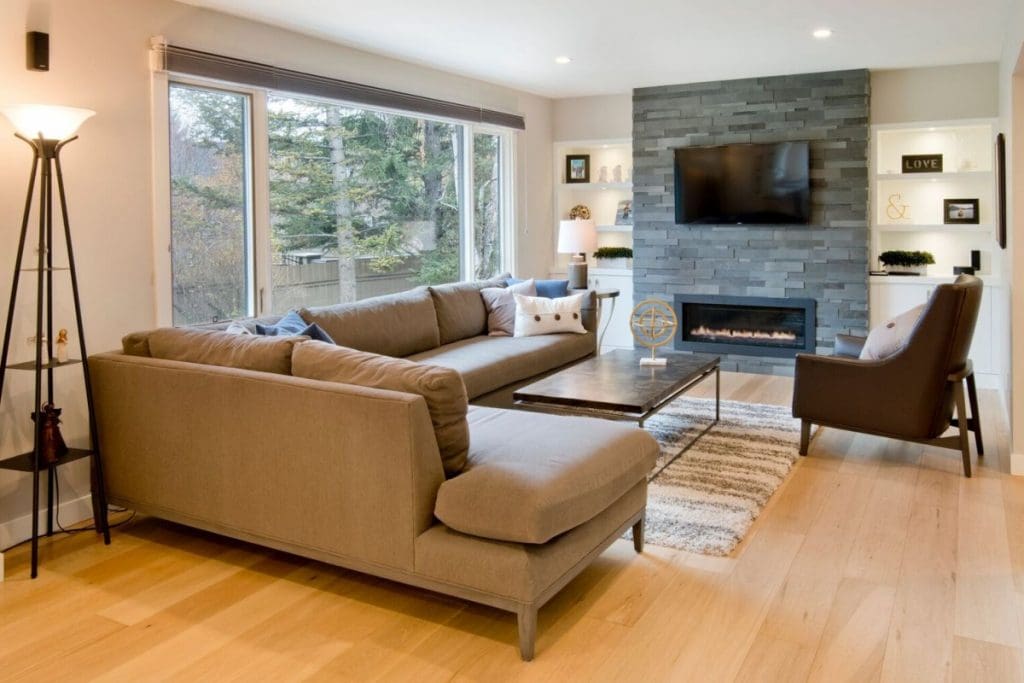 Renova Homes and renovations custom home in canyon meadows living room with light hardwood flooring