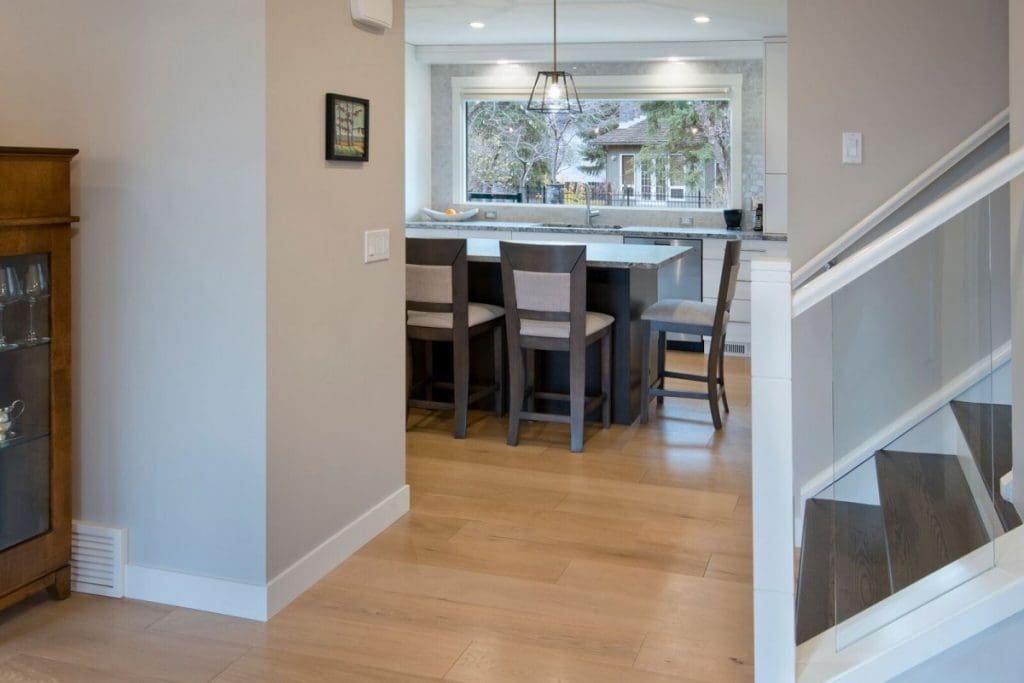 Canyon Meadows Project By Renova Homes & Renovations Calgary, Alberta with new hardwood floors and glass railings