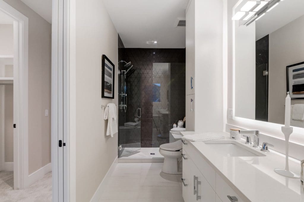 CasaBianca Townhomes By Renova Homes & Renovations Calgary, Alberta full ensuite with diamond tiled shower and glossy white cabinets