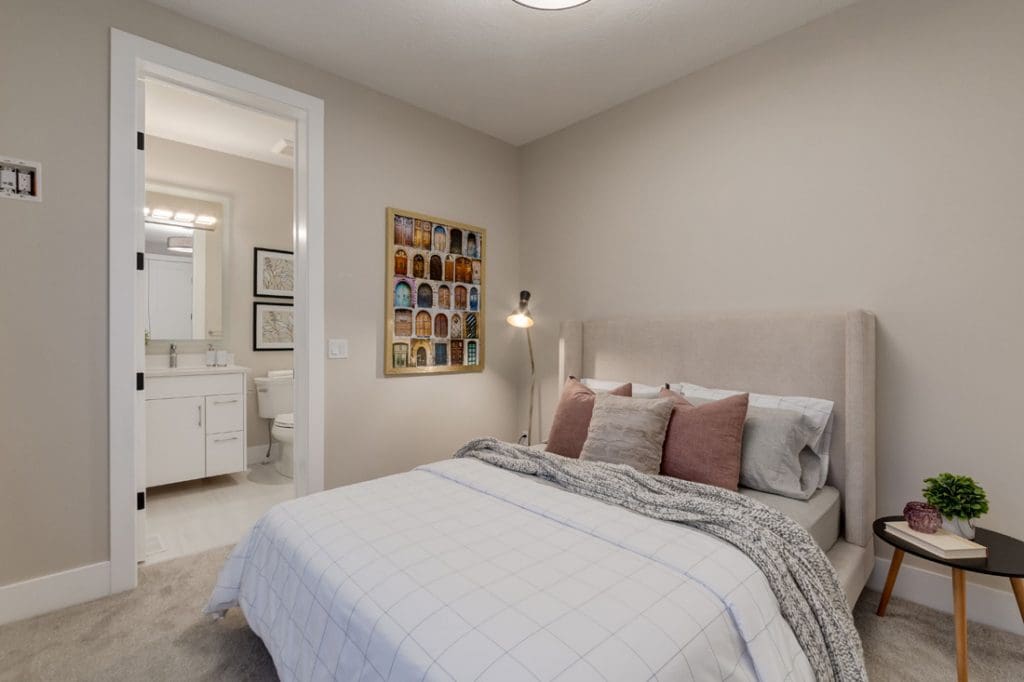 New custom build apartment building in Calgary, master bedroom with ensuite by renova homes and renovations
