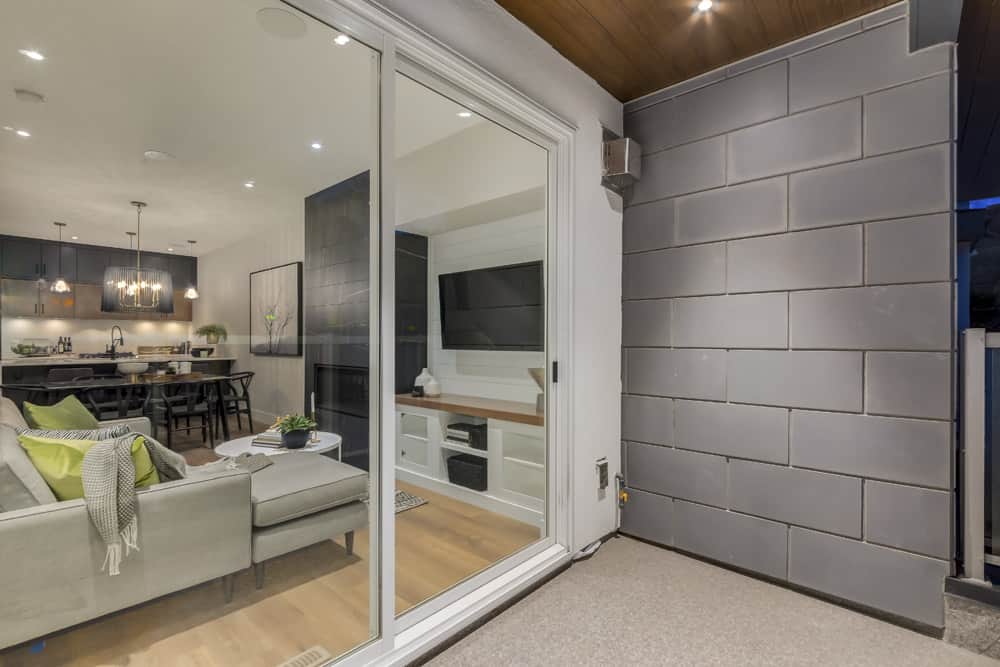 Casa Bianca Townhomes patio looking into living room By Renova Homes & Renovations Calgary, Alberta