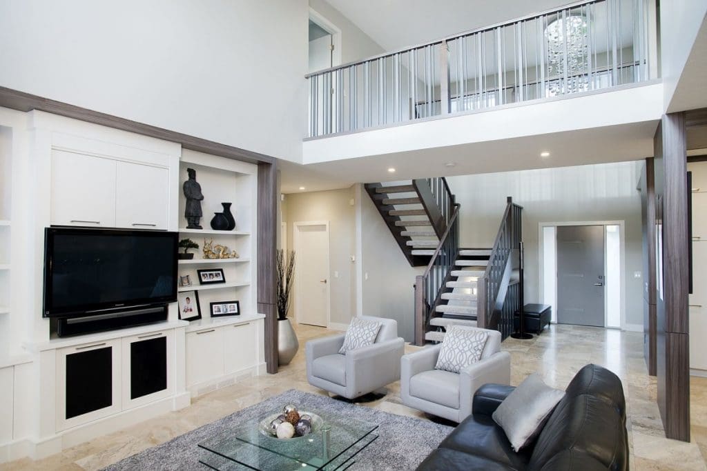 Edgemont home by renova homes and renovations new foyer with contrast between light and dark woods and tiled floor throughout