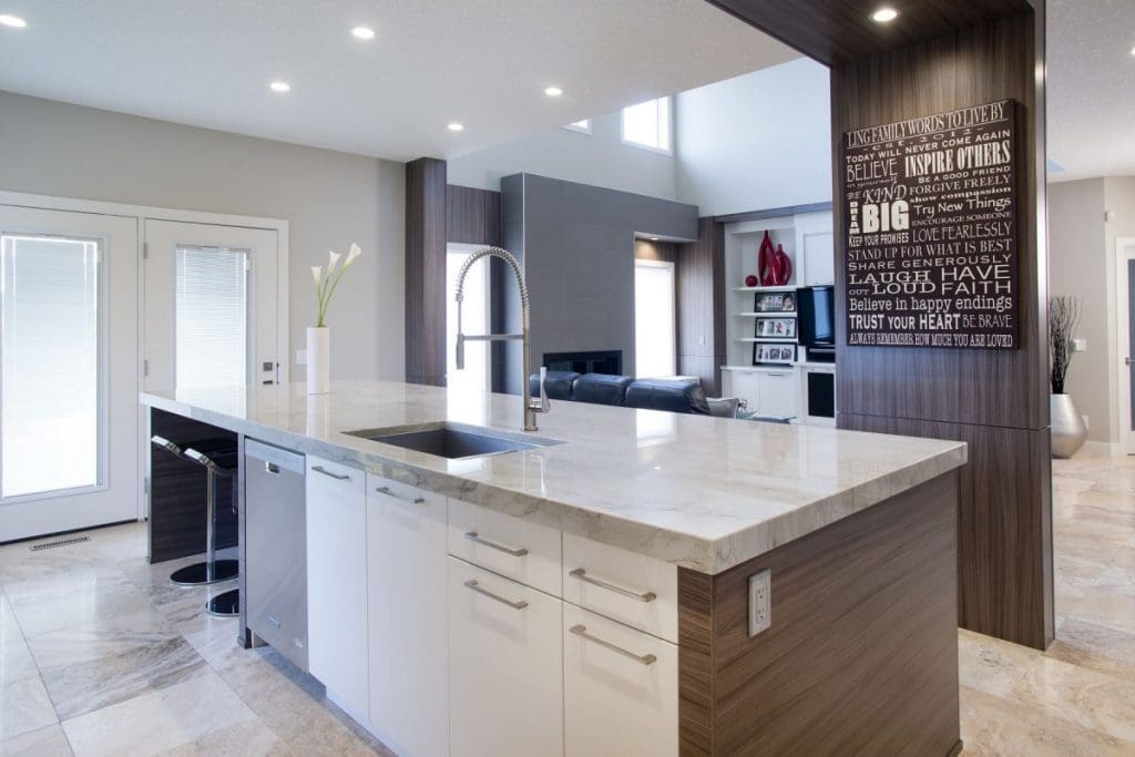 Edgemont Contemporary Twist Project By Renova Homes & Renovations Calgary, Alberta kitchen island and living room with neat wooden arch feature on ceiling
