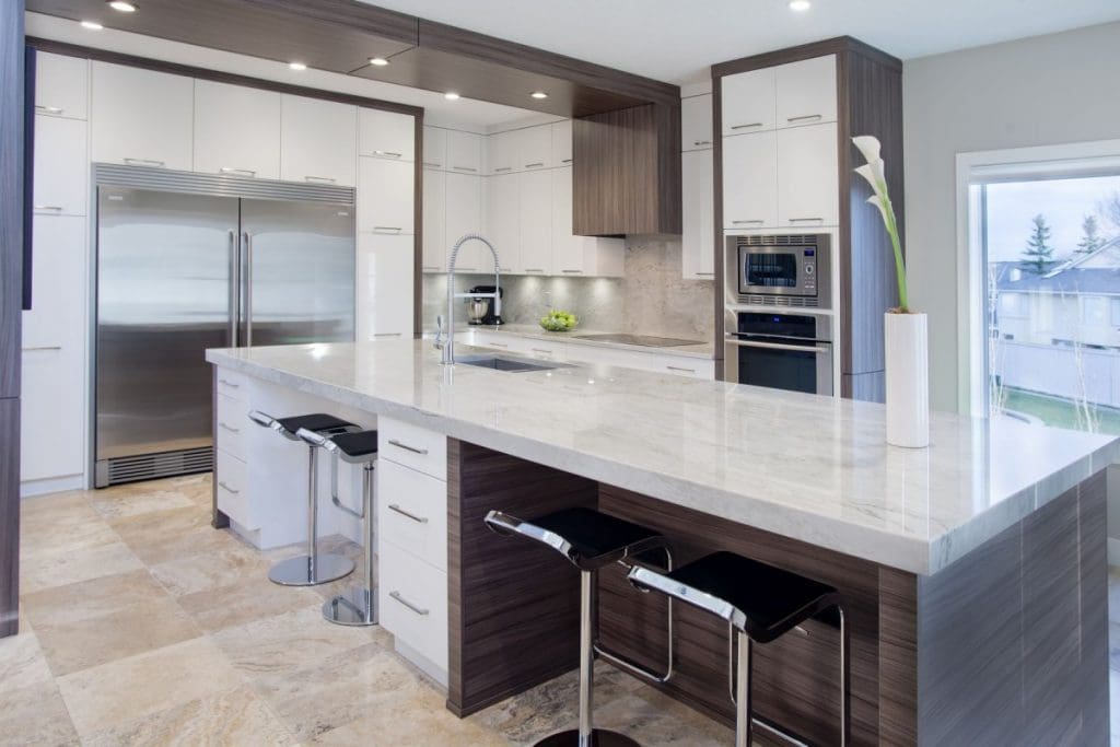 Edgemont Contemporary Twist Project By Renova Homes & Renovations Calgary, Alberta grand kitchen with mixed toned of white and brown cabinetry