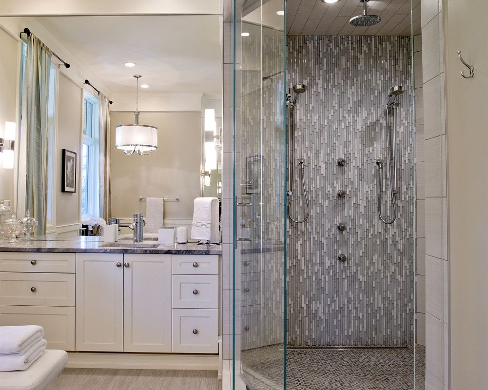 Ensutie renovation with walk in tile shower and full vanity by renova homes and renovations