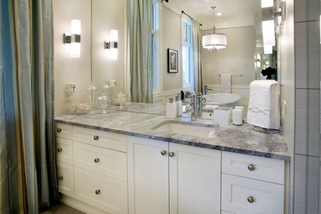 Elbow Valley Ensuite Project By Renova Homes & Renovations Calgary, Alberta ensuite bathroom with bright natural light and soaker tub underneath the windows