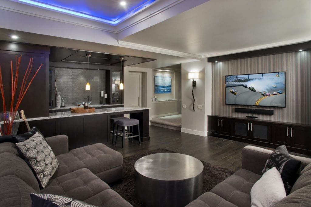 Hamptons Basement renovations with dark tones creating a mancave vibe