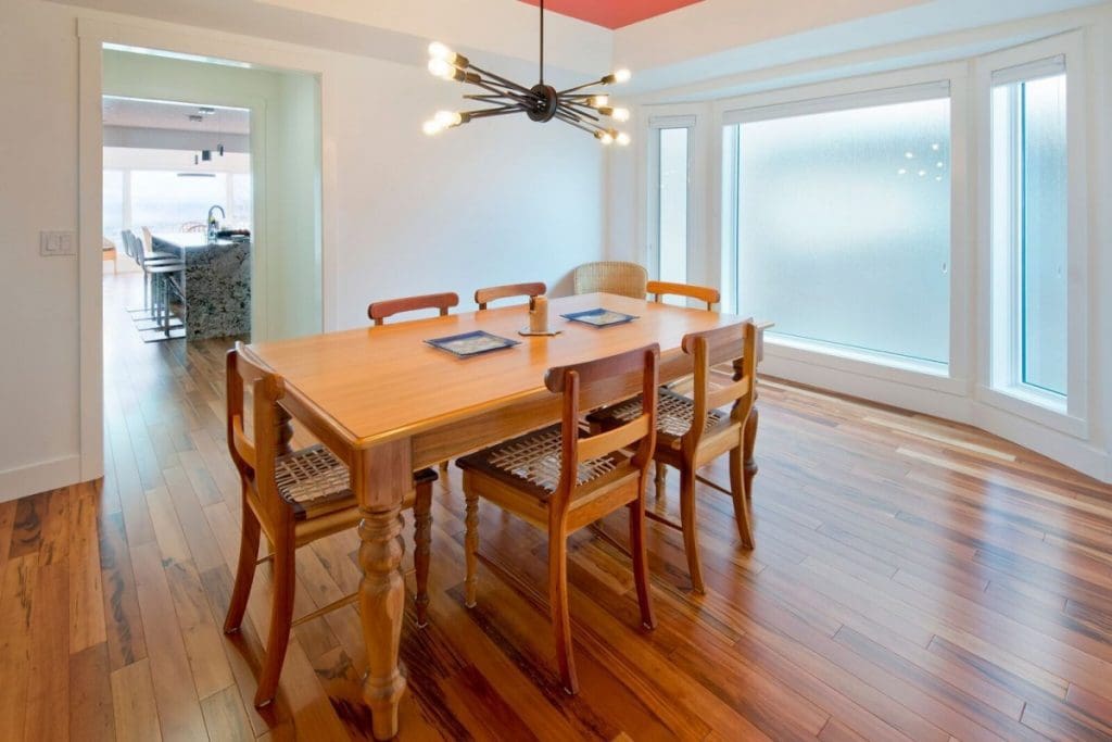 HAwkwood community by renova homes and renovations showcase large floor to ceiling windows with a spacious dining room