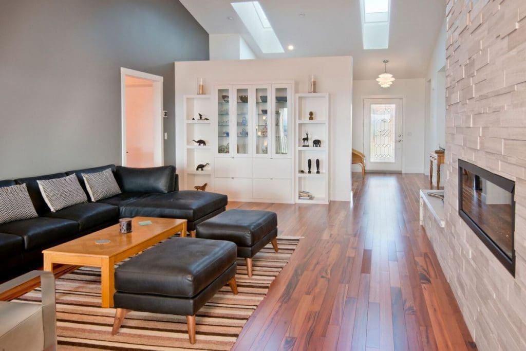 Hawkwood Renovation By Renova Homes & Renovations Calgary, Alberta living room with stone fireplace