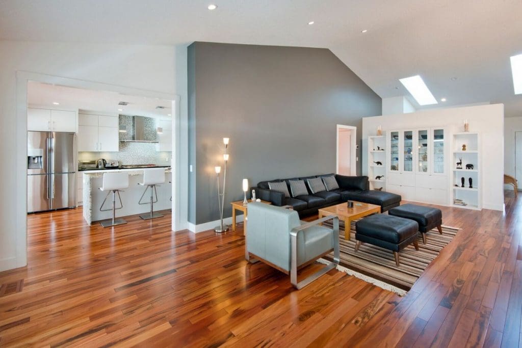 Hawkwood Renovation By Renova Homes & Renovations Calgary, Alberta spacious living room leading into modernized kitchen