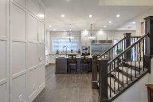 Hounsfield Heights Custom Home By Renova Homes & Renovations Calgary, Alberta with a custom wall feature and deep oak stairwell