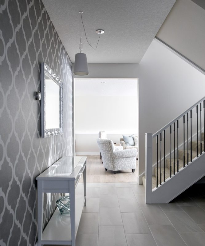 Lake Bonavista Renovation entry way leading to stairs By Renova Homes & Renovations Calgary, Alberta