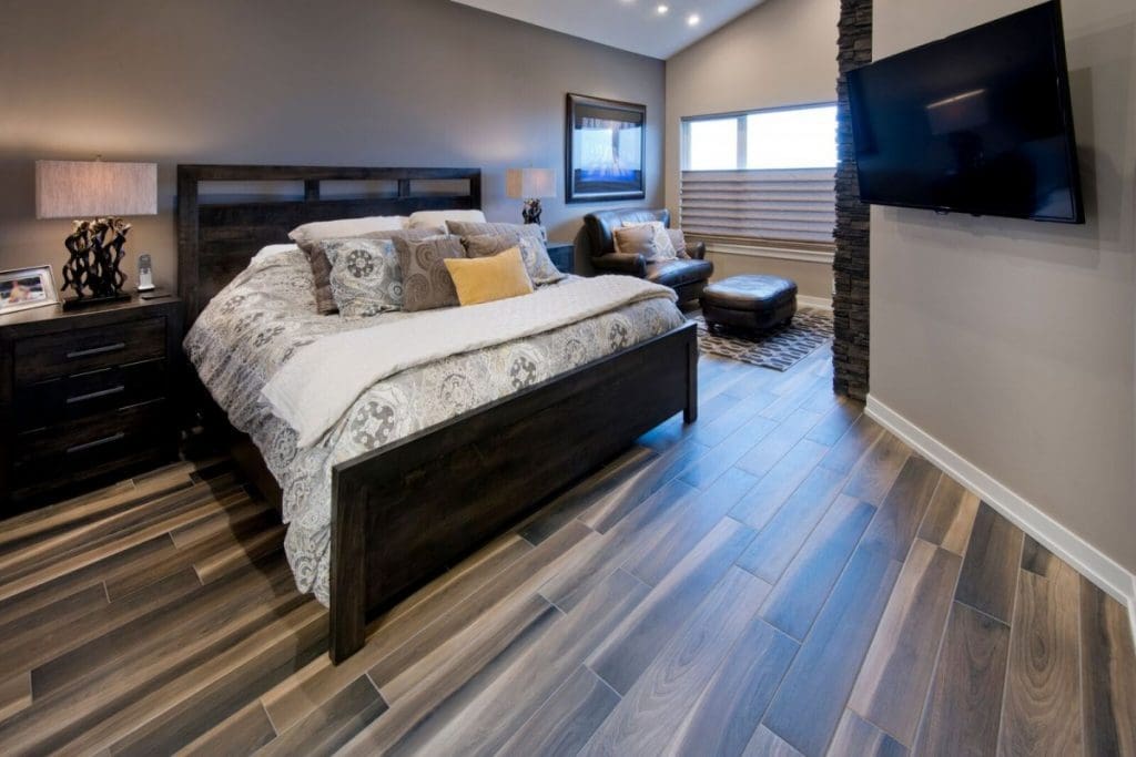 Renova Homes and renovations master bedroom with stone fireplace