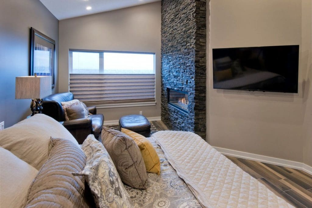 renova homes and renovations renovated a master bedroom with stone fireplace and living quarters