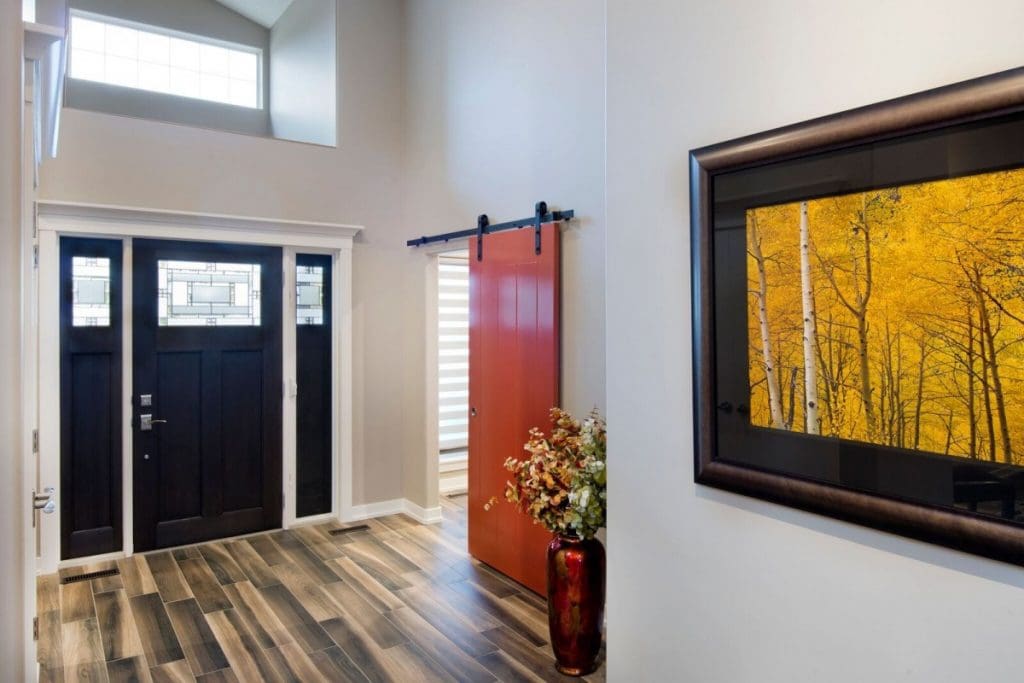 Mckenzie Renovation By Renova Homes & Renovations Calgary, Alberta front entry with red barn door