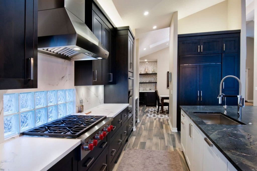 Mckenzie kitchen renovation in calgary with custom new wolf stovetop and granite countertops