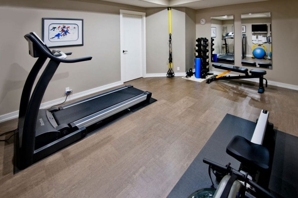 Mckenzie community calgary by renova homes and renovations basement gym and cork flooring
