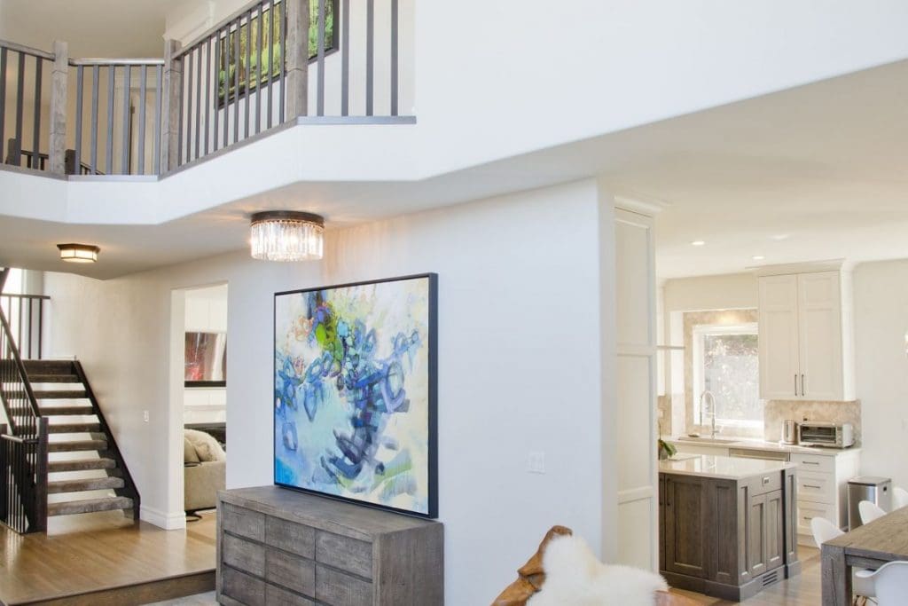 Patterson Interior Project By Renova Homes & Renovations Calgary, Alberta beautiful front entry way that landscapes the living room all the way to teh staircase