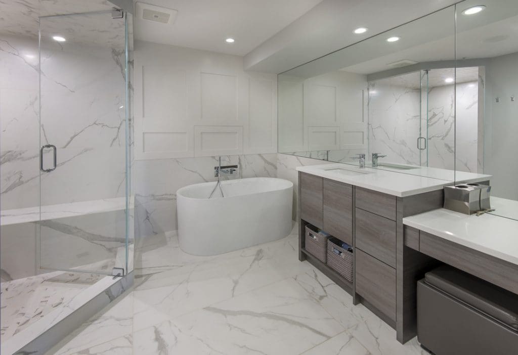 Princeton By Renova Homes & Renovations Calgary, Alberta ensuite with marble tiled floors and walls before custom crowning and walk in steam shower
