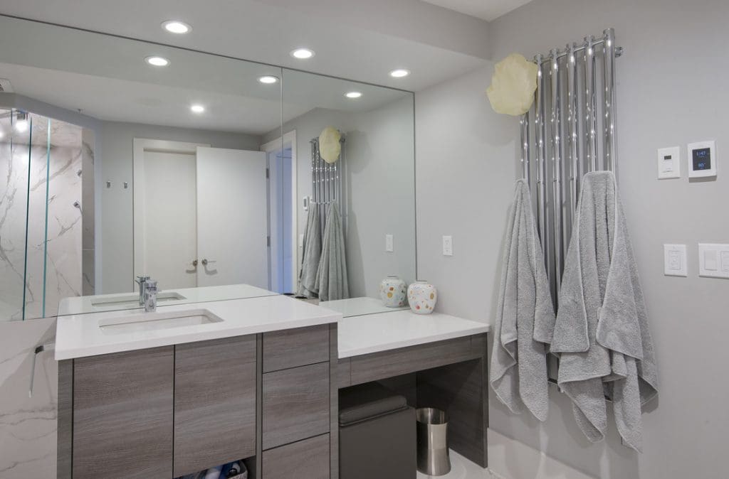 Bathroom renovaation by renova homes and renovations with vanity and towel warmer