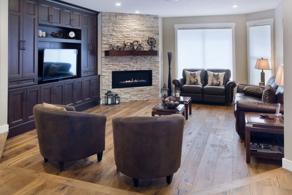living room renovation with stone fireplace and floating shelfs