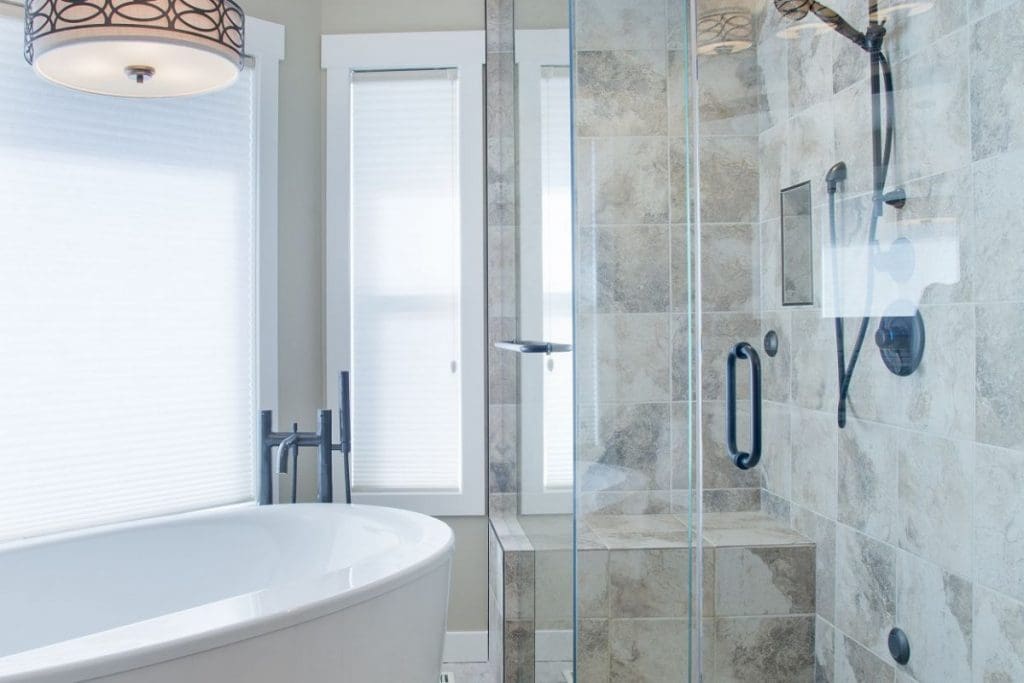 Scenic Acres Main Floor Project By Renova Homes & Renovations Calgary, Alberta ensuite master bedroom with soaker stand alone tub