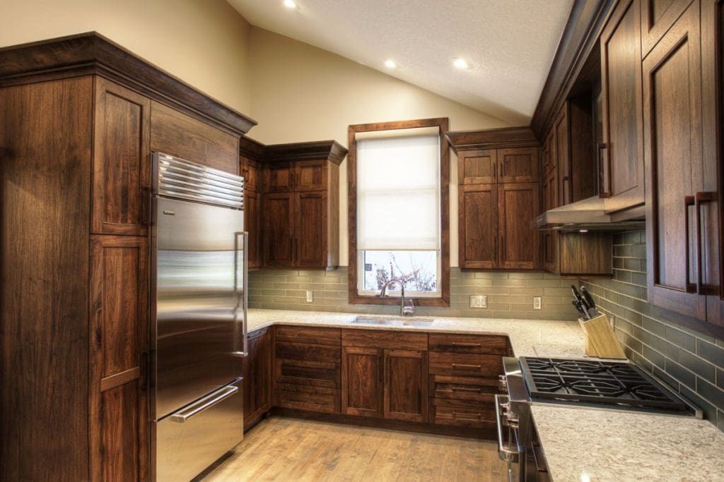 custom dark wood cabinetry with granite countertops