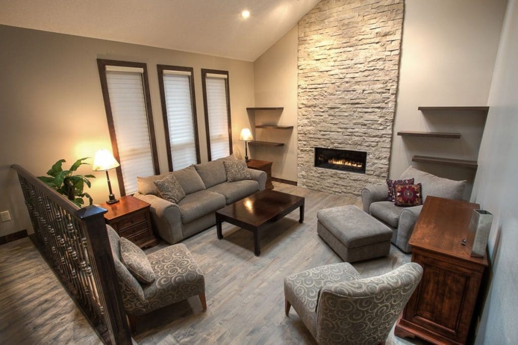 Silverspring living room renovation with stone fireplace and floating shelfs