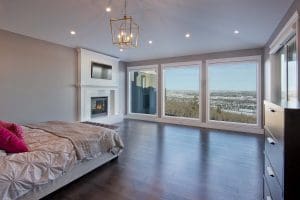 Southwest Calgary Custom Home By Renova Homes & Renovations Calgary, Alberta master bedroom looking out onto edworthy park calgary with floor to ceiling windows