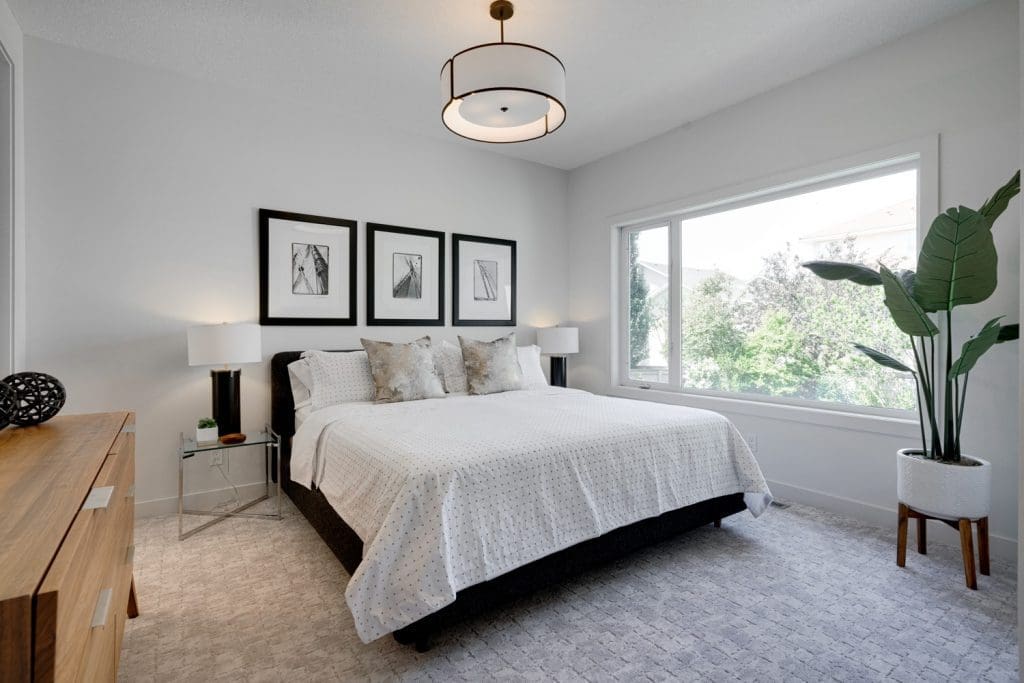 Arbour Lake Renovated Master Bedroom overlooking backyard by Renova Homes & Renovations In Calgary, Alberta