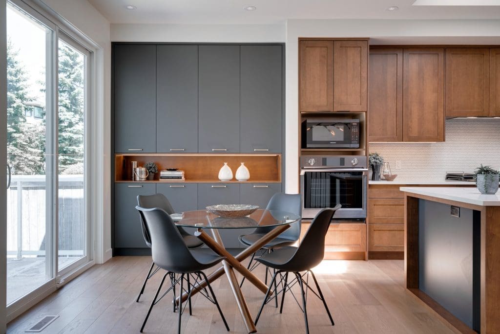 Arbour Lake Dining Area overlooking backyard by Renova Homes & Renovations In Calgary, Alberta