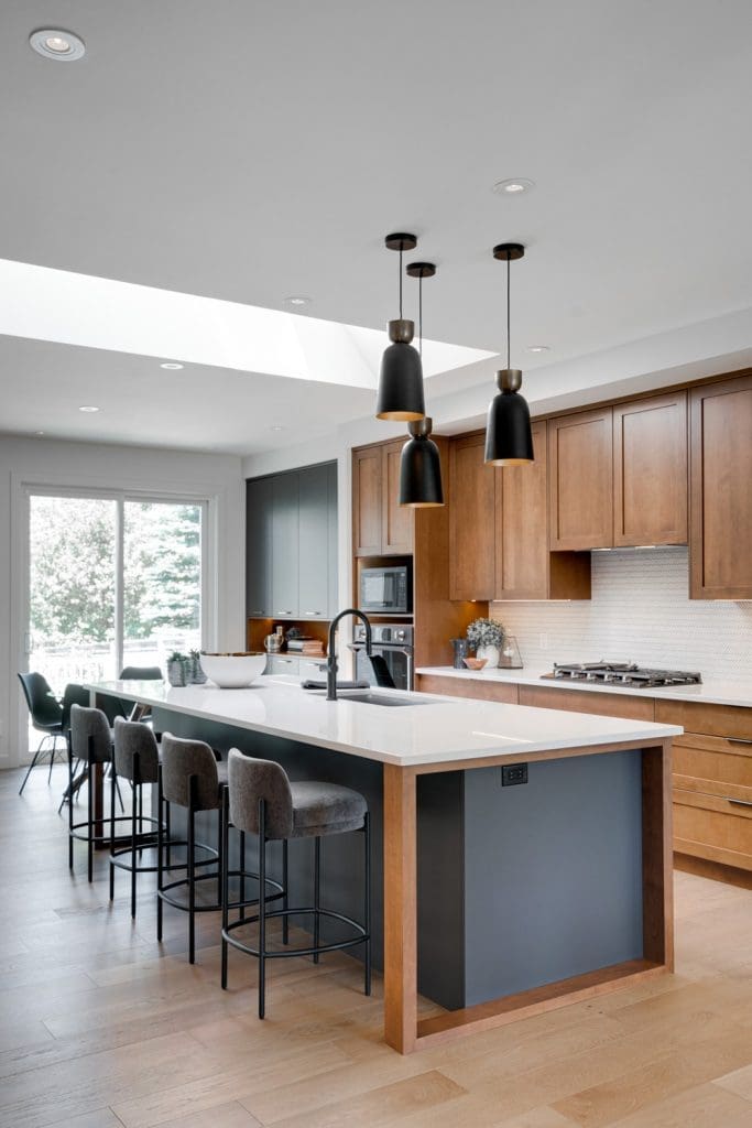 Arbour Lake Renovated Kitchen with a massive skylight by Renova Homes & Renovations In Calgary, Alberta
