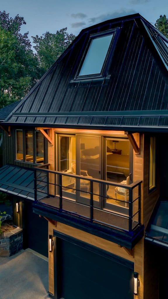 Springbank Renovation By RENOVA HOMES & RENOVATIONS View of metal roof and screened patio