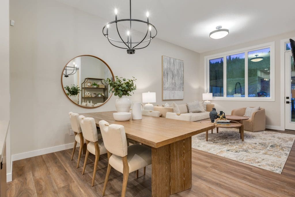 River Pointe Villas By RENOVA Homes & Renovations Kitchen and living room looking out on the treed hill