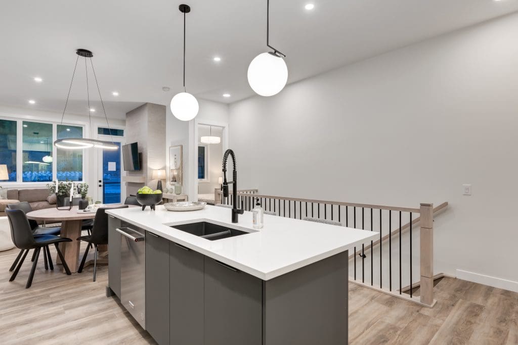 Kitchen looking out into the stairs going downstairs