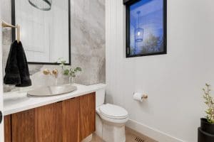 Bearspaw Custom Home Half Bath with Tile wall