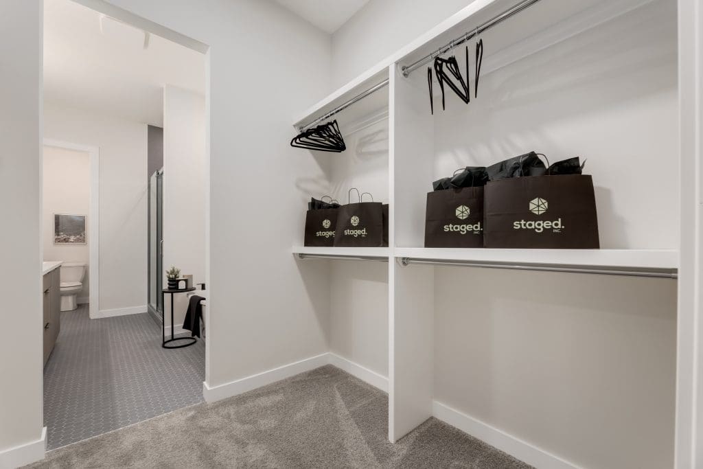 Master bedroom closet by Staged